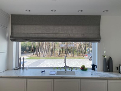 A modern living room with black curtians and black voile curtains