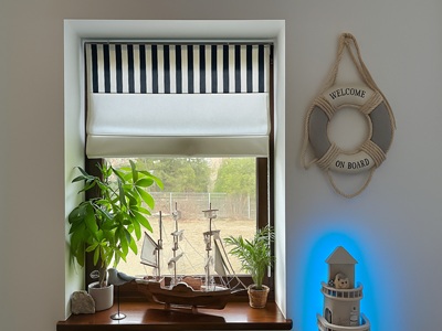 A modern living room with black curtians and black voile curtains