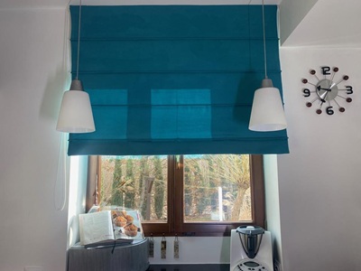 A modern living room with black curtians and black voile curtains